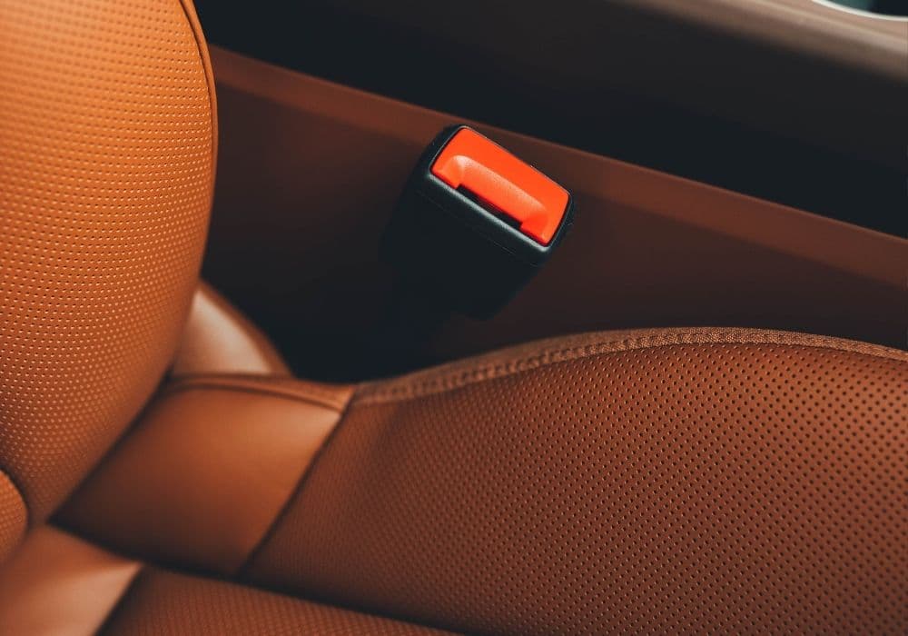 Tan perforated leather car seats protected with ceramic leather coating in Vancouver